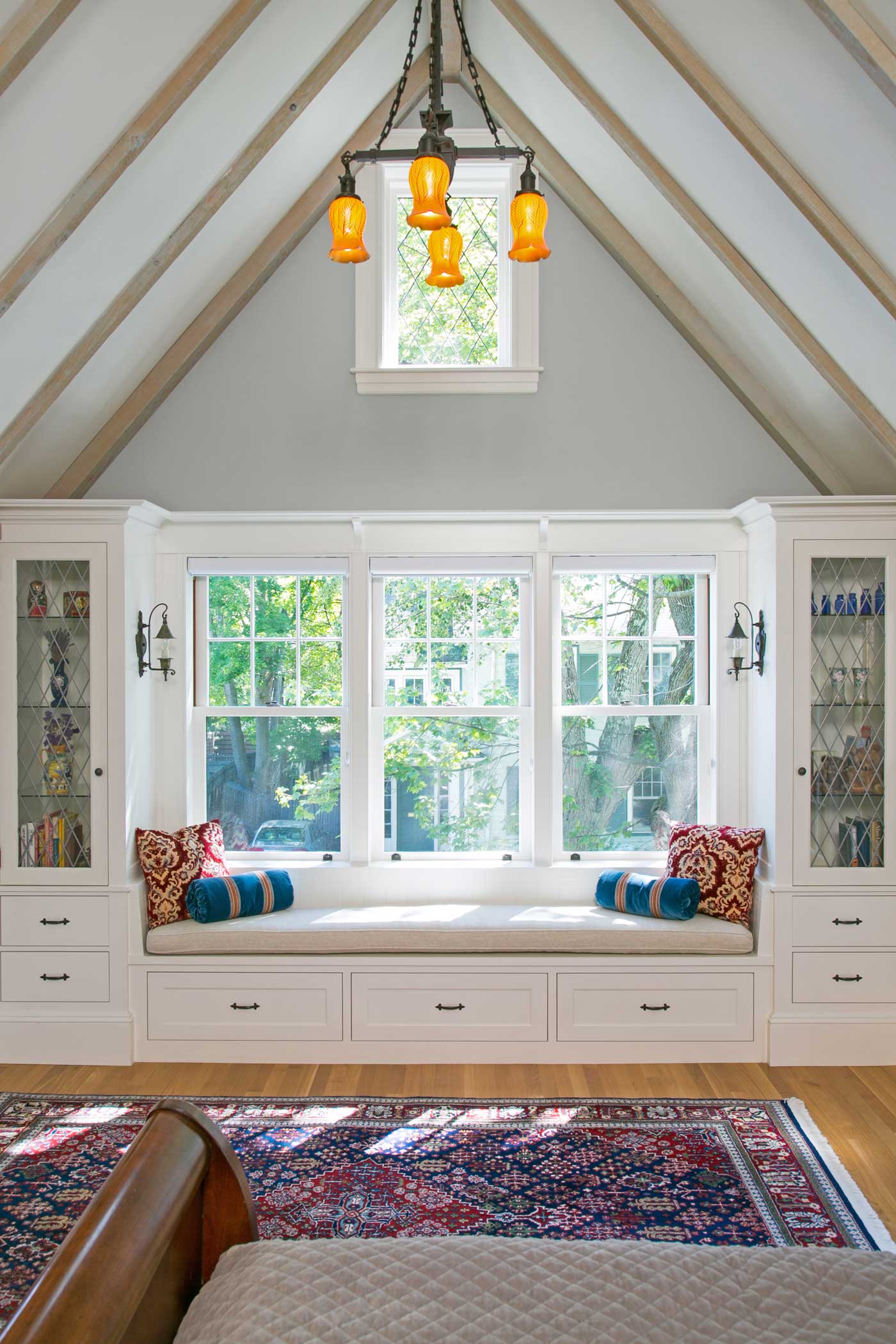 window seat in family room with cathedral ceilings