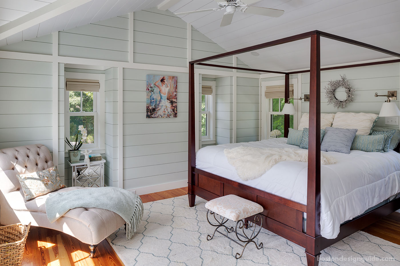 Coastal bedroom with nickel gap wood paneling by custom home builder Bannon Custom Builders