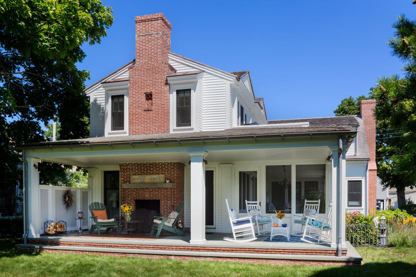 Custom Cape home with fireplace porch by Bannon Custom Builders