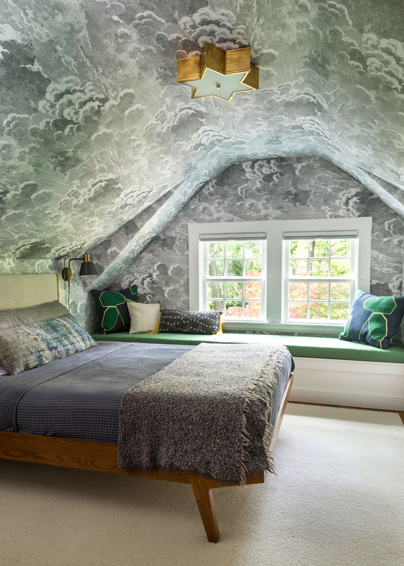Bedroom with ceiling wallpaper based on a Moroccan tile roof