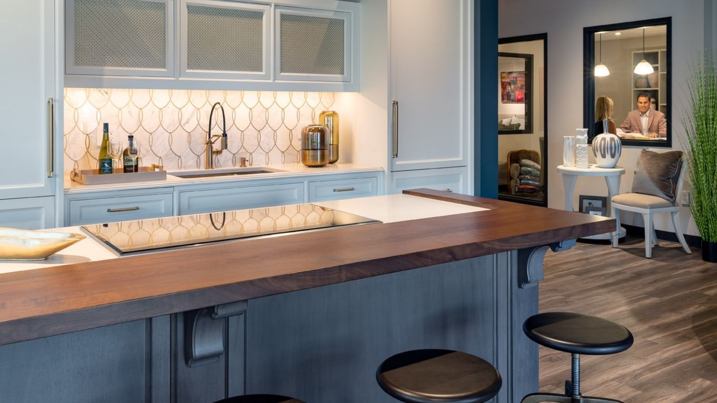 View of a sample kitchen with blue accents in Interiology design center