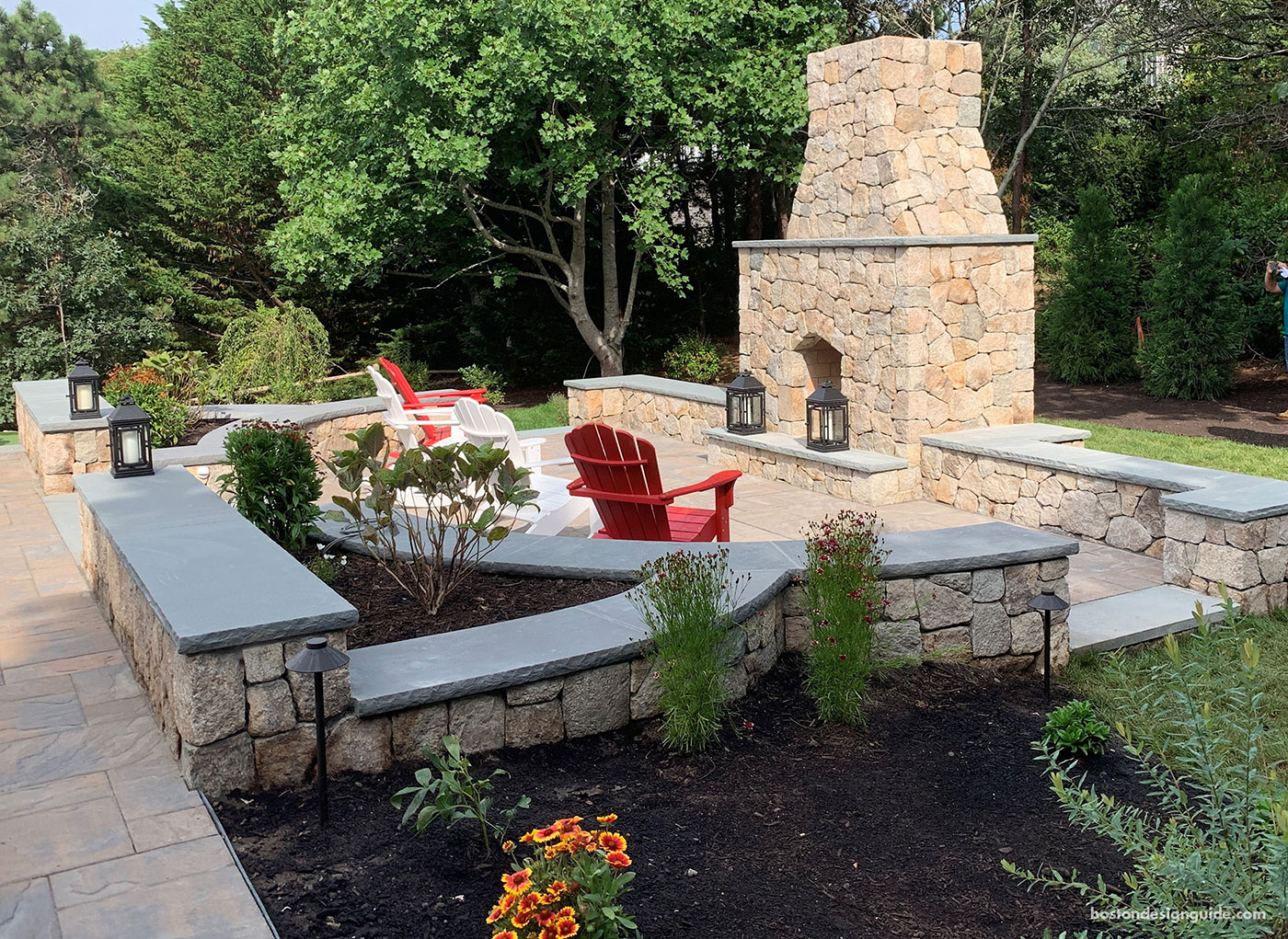 Outdoor living with custom outdoor fireplace by Blue Claw Landscape Development