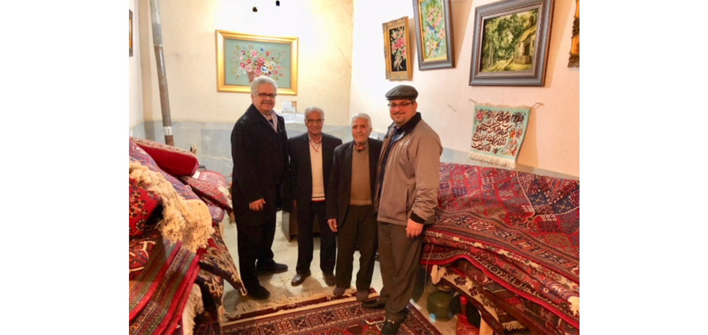 Bahman Kimiachi meets with rug shop owners in Iran