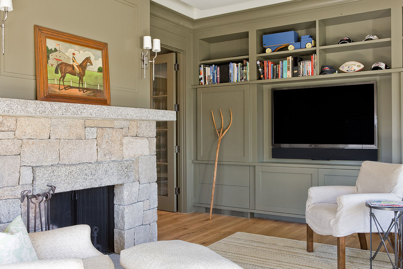 High-end transitional family room by Brookes + Hill Custom Builders