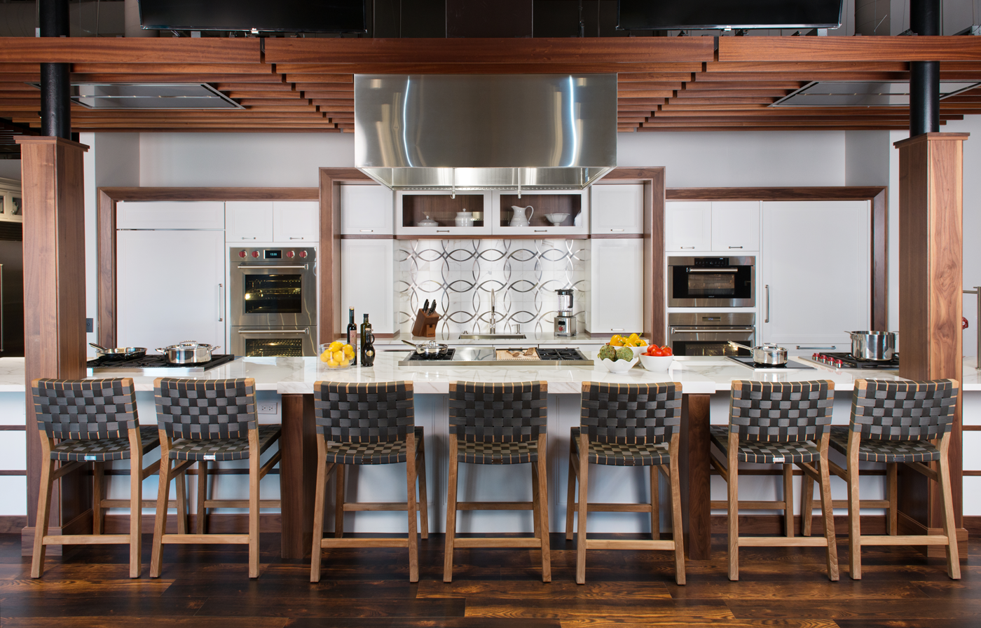 Clarke showroom kitchen with long island set up with seven stools