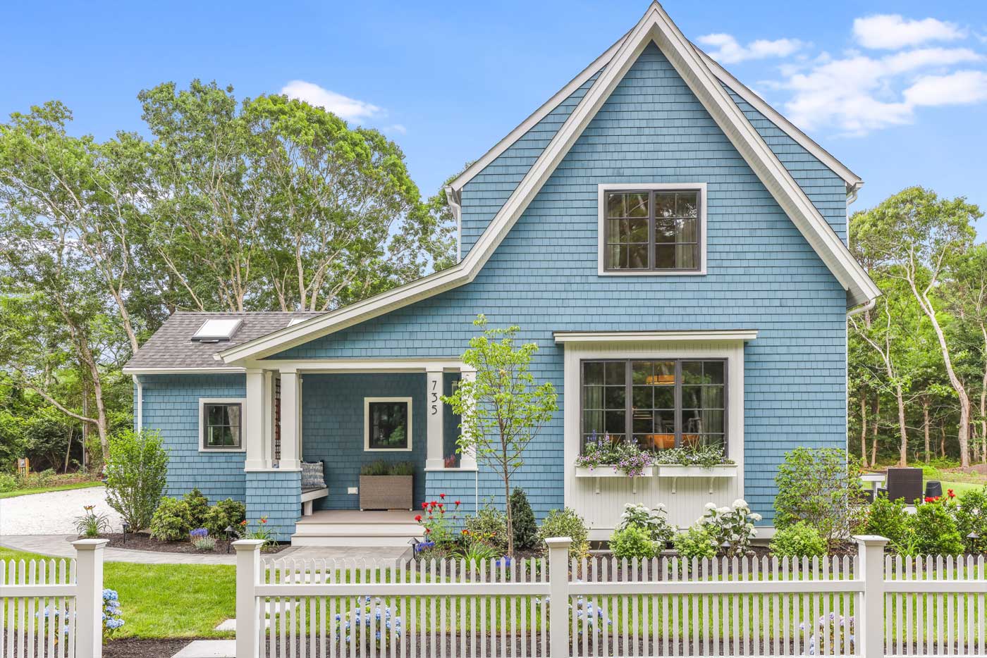 Front view of small blue cottage