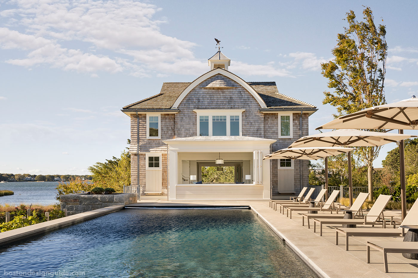 Classic Cape Cod poolhouse with cupola designed by Catalano Architects and constructed by KVC Builders