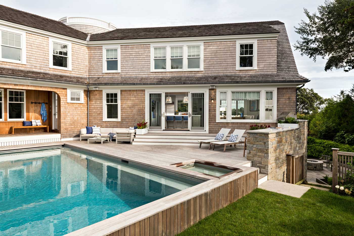 back view of house with pool and deck