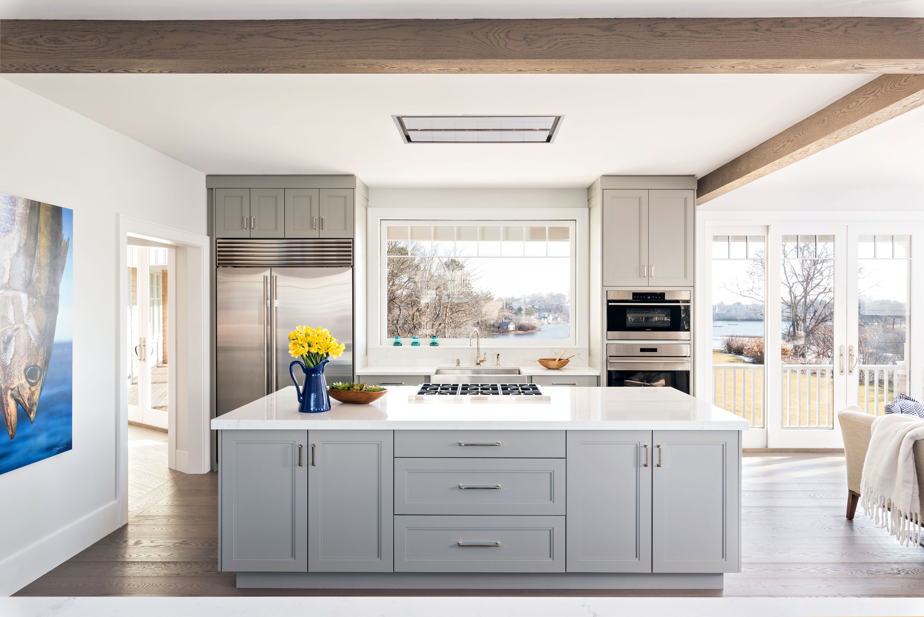 Kitchen with gray cabinets and view of water