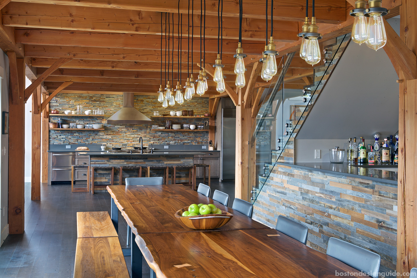 High-end custom dining room with stone for a Maine home renovation by Slocum Hall Design Group