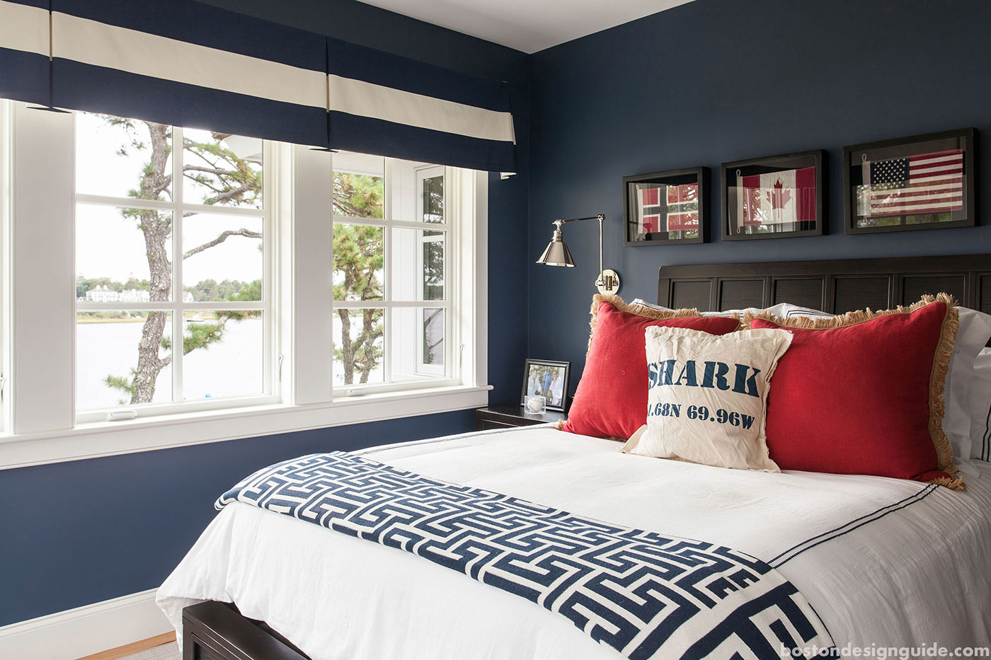 Red, white and blue bedroom by high-end builder Rick Roy Construction