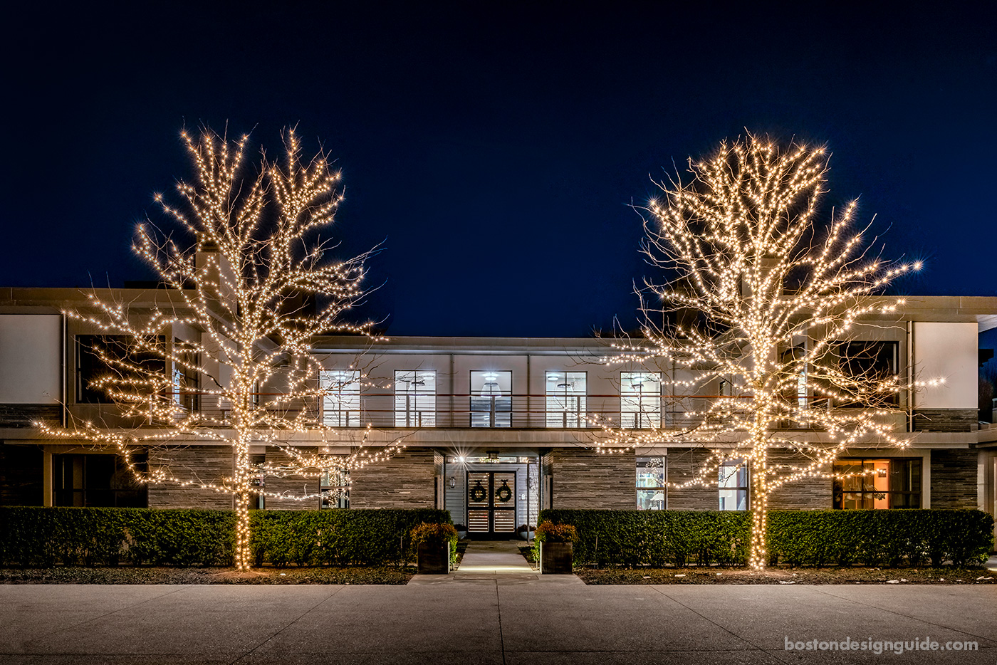 High-end contemporary home with holiday lights by R.P. Marzilli & Co.