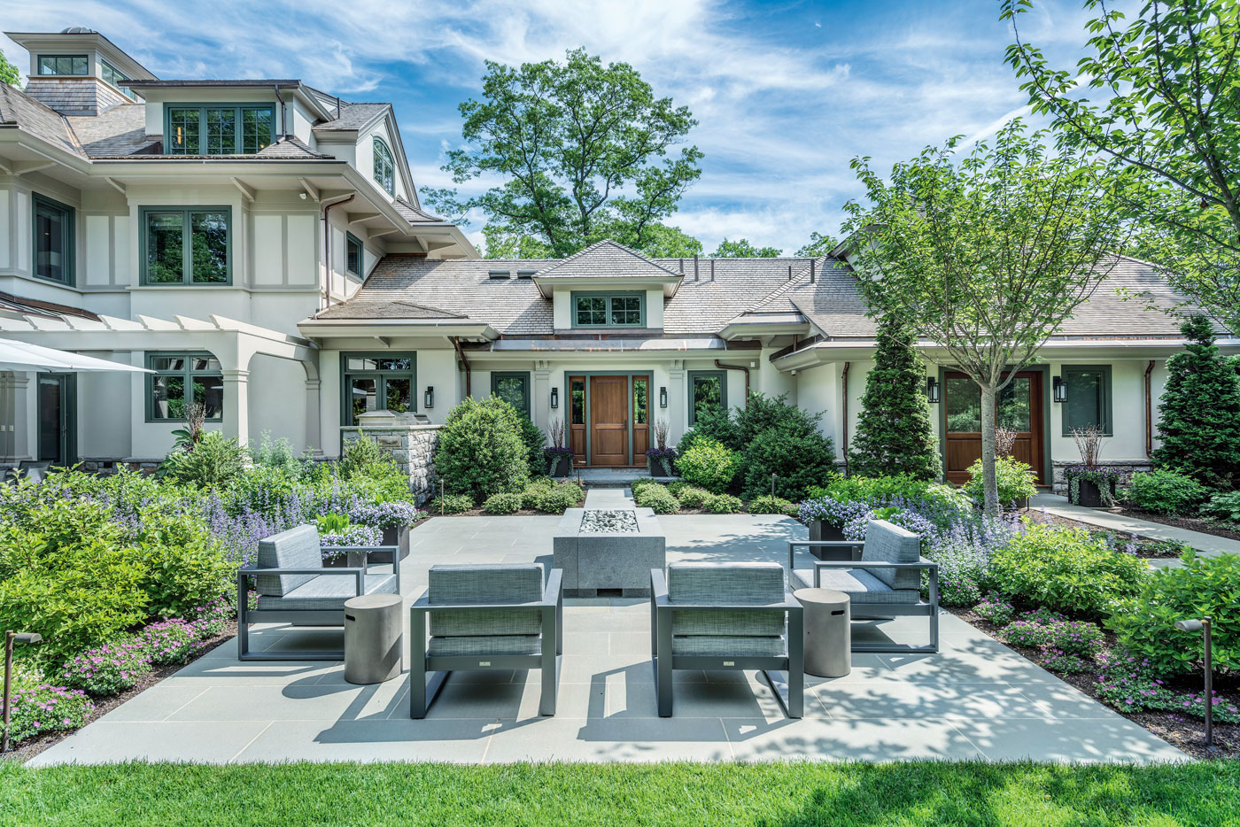 Custom patio for outdoor living in a high-end Boston home designed by Morehouse MacDonald and Associates and built by Sanford Custom Builders, Inc.