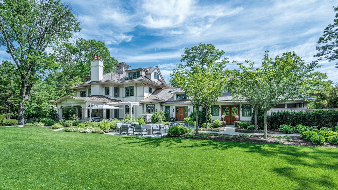 Outdoor living in a high-end custom Boston suburban home with landscape architecture by Gregory Lombardi Design Incorporated, and landscape construction by Landscape Creations.