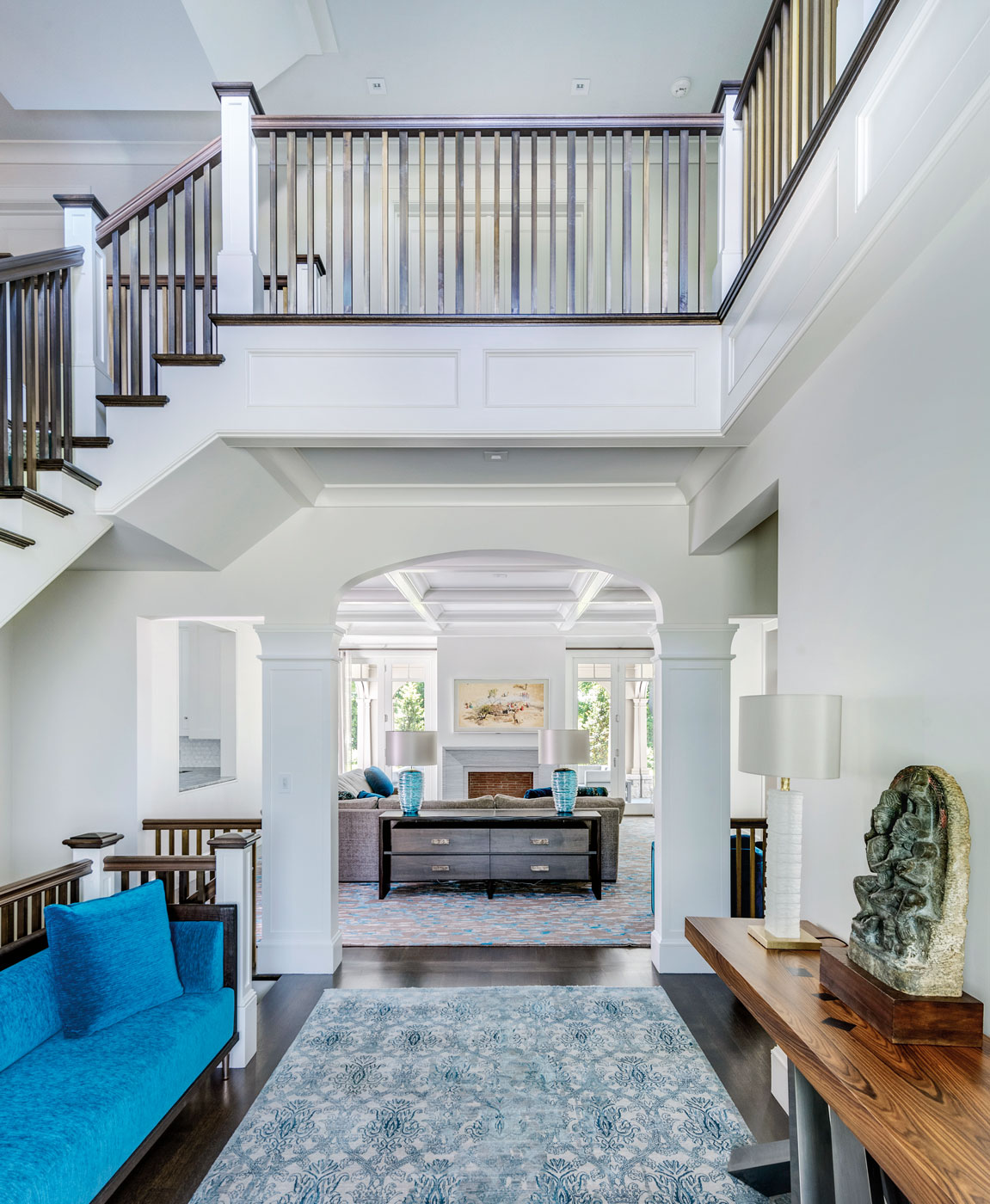 Stair hall of a high-end custom suburban Boston home designed by architect Morehouse MacDonald and Associates and constructed by Sanford Custom Builders.