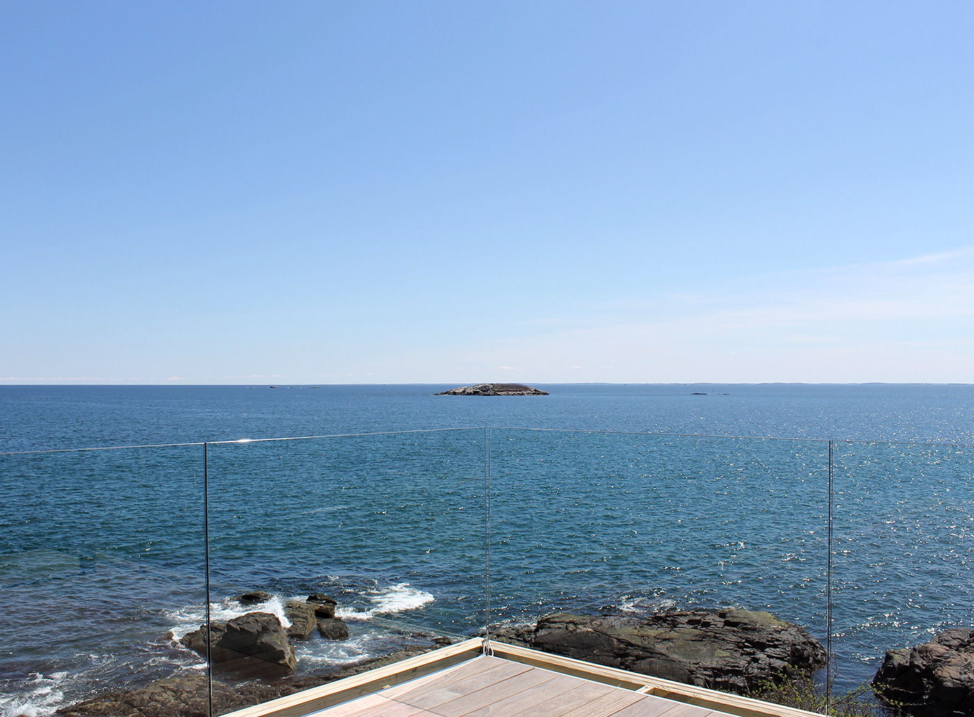 Ultra modern makeover for a traditional oceanfront home in Marblehead by Groom Construction Co.