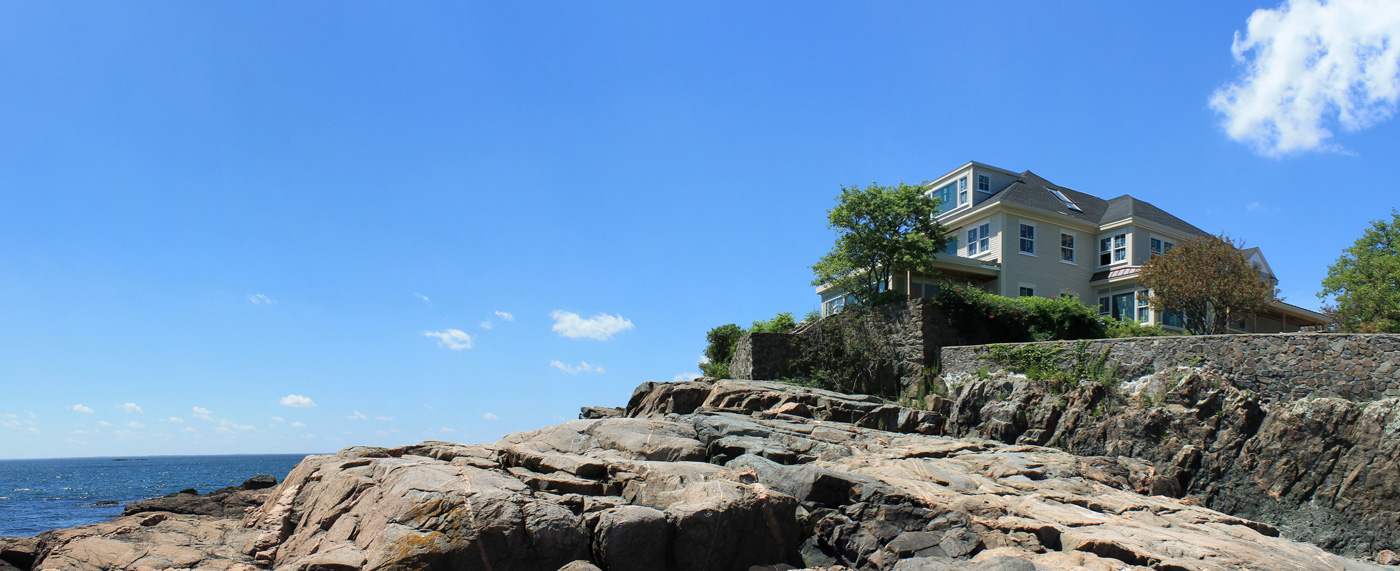 Ultra modern makeover for a traditional oceanfront home in Marblehead by Groom Construction Co.