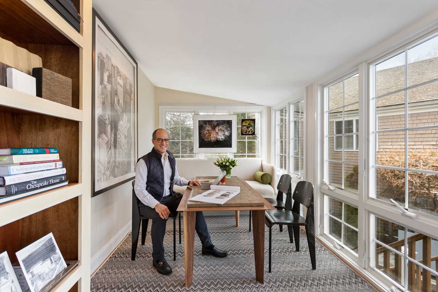 Nick Stanos sitting at a desk in his office