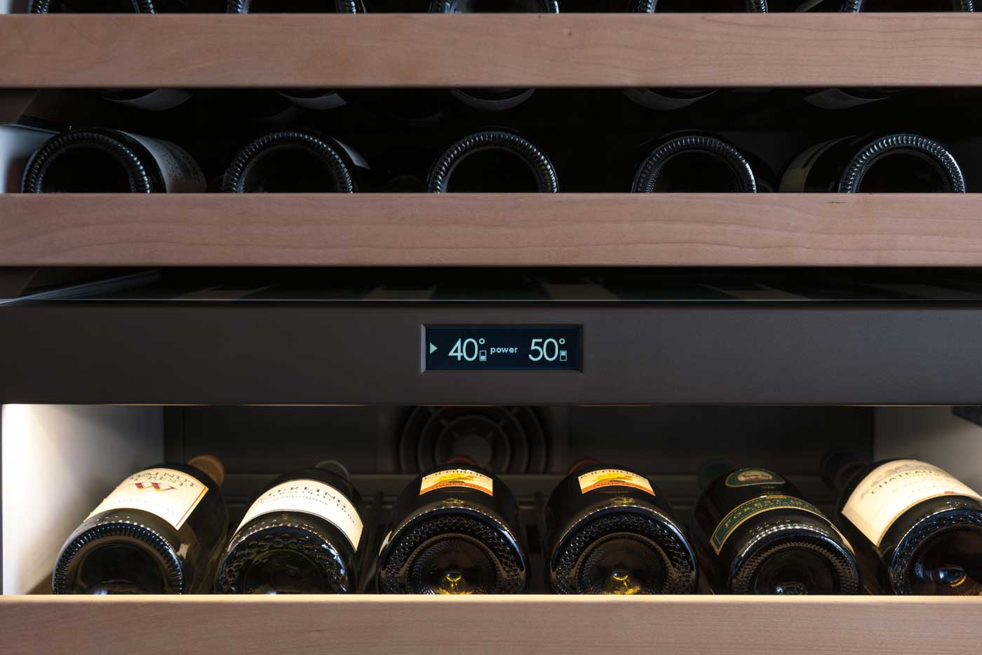 Wine bottles in wine refrigerator