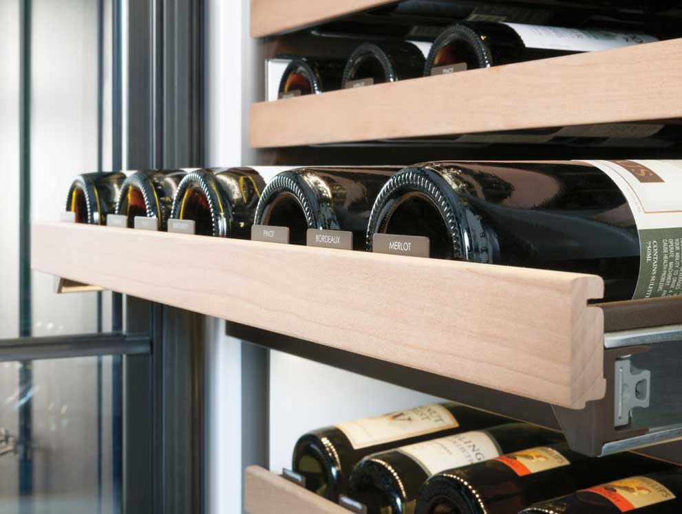 Wine bottles in wine refrigerator