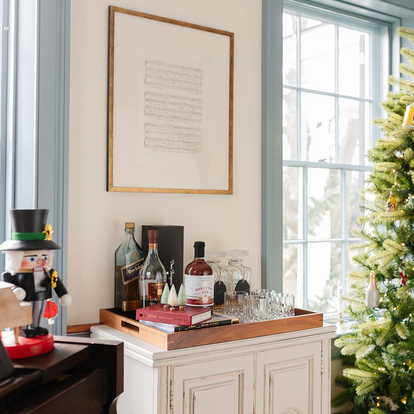 bar cart next to a Christmas tree