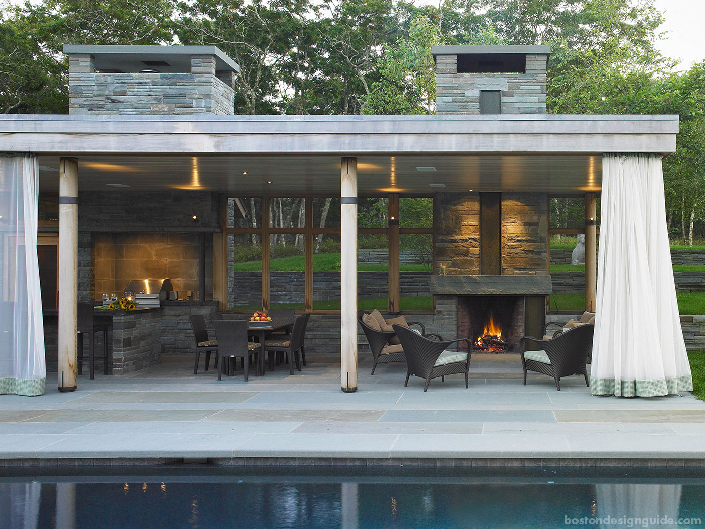 Coastal pool house with a fireplace by Jill Neubauer Architects