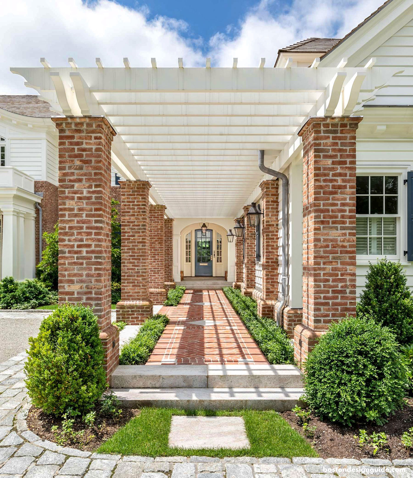 Front entry of home with Pergola overhang