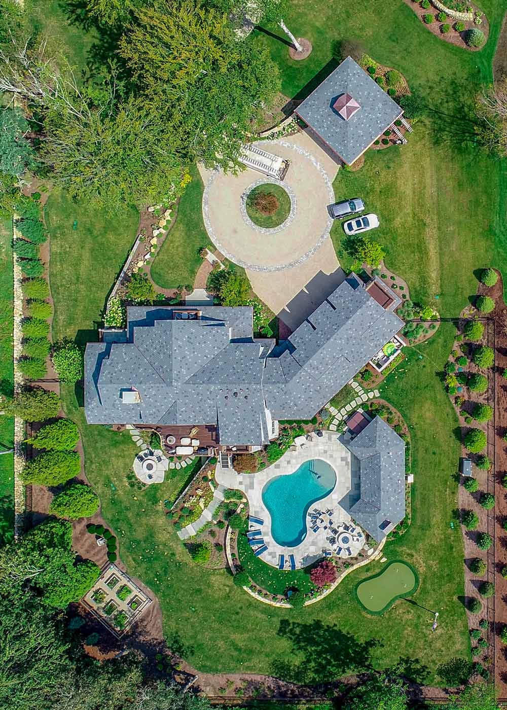 Outdoor program with a putting green installed by Landscape Creations