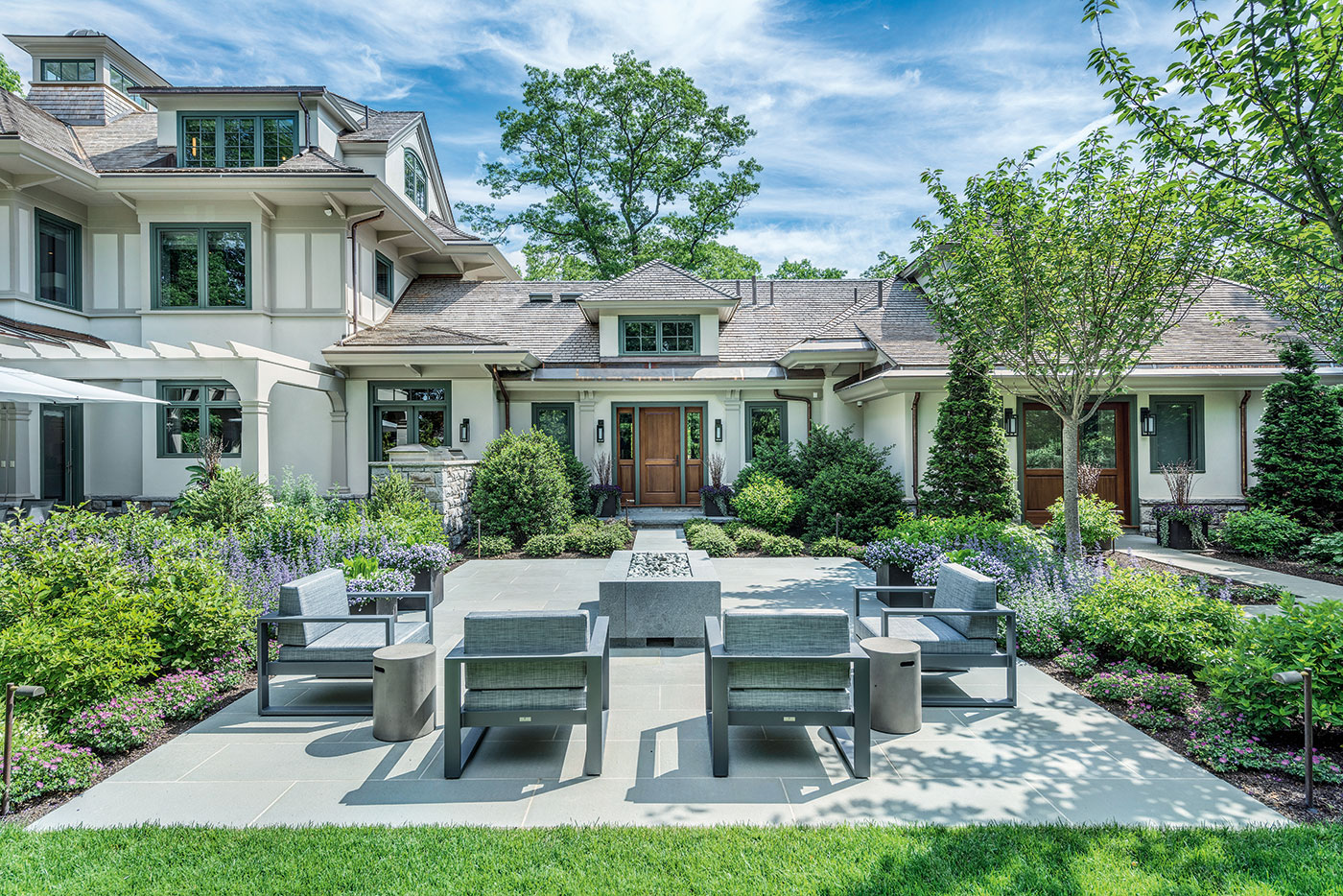 Outdoor living room by Gregory Lombardi Design with landscape construction by Landscape Creations