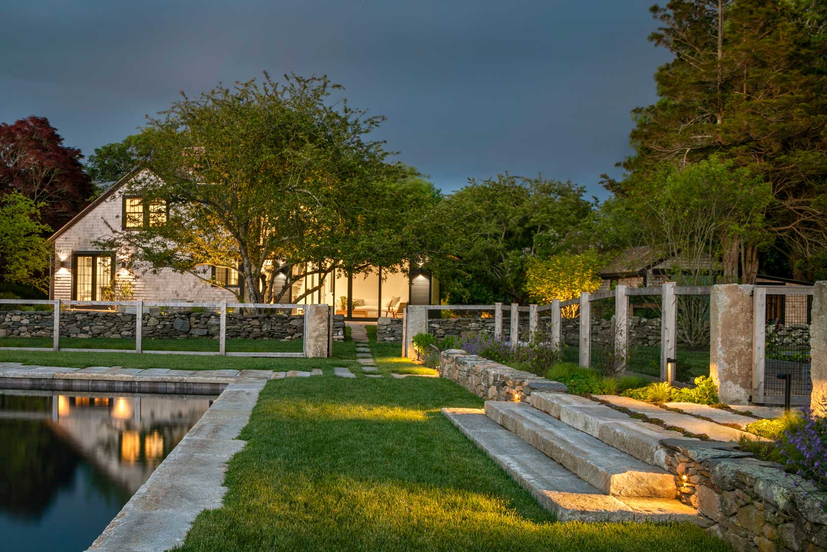 dusk shot of Little Compton home from the back yard