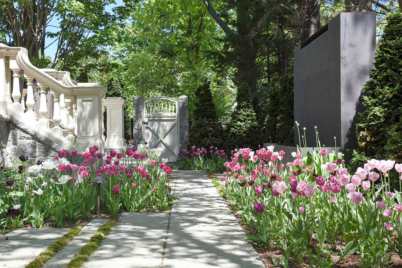 A flower-lined gateway by Matthew Cunningham Landscape Design