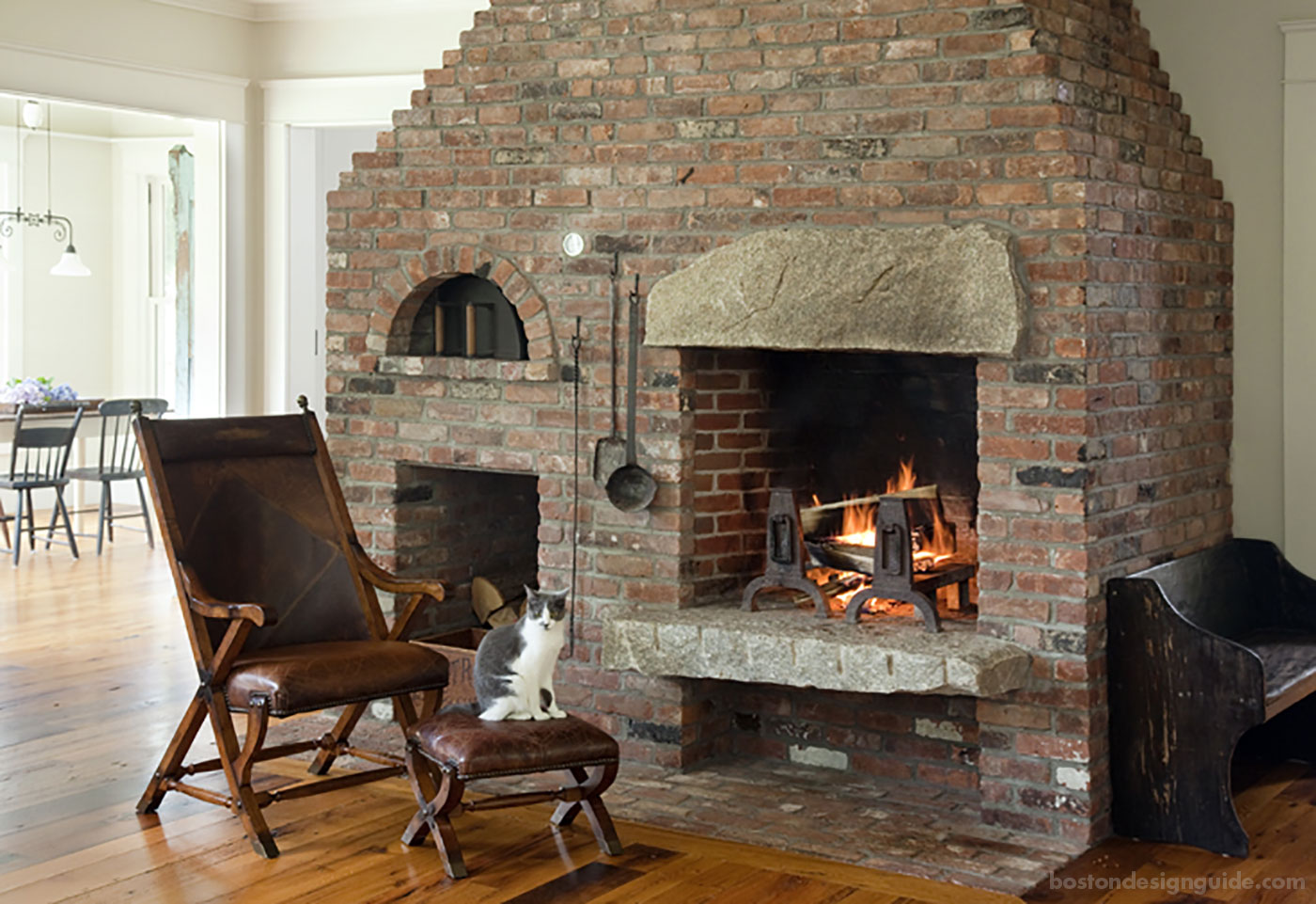 Cozy fireplace in a great room by D. Michael Collins Architects