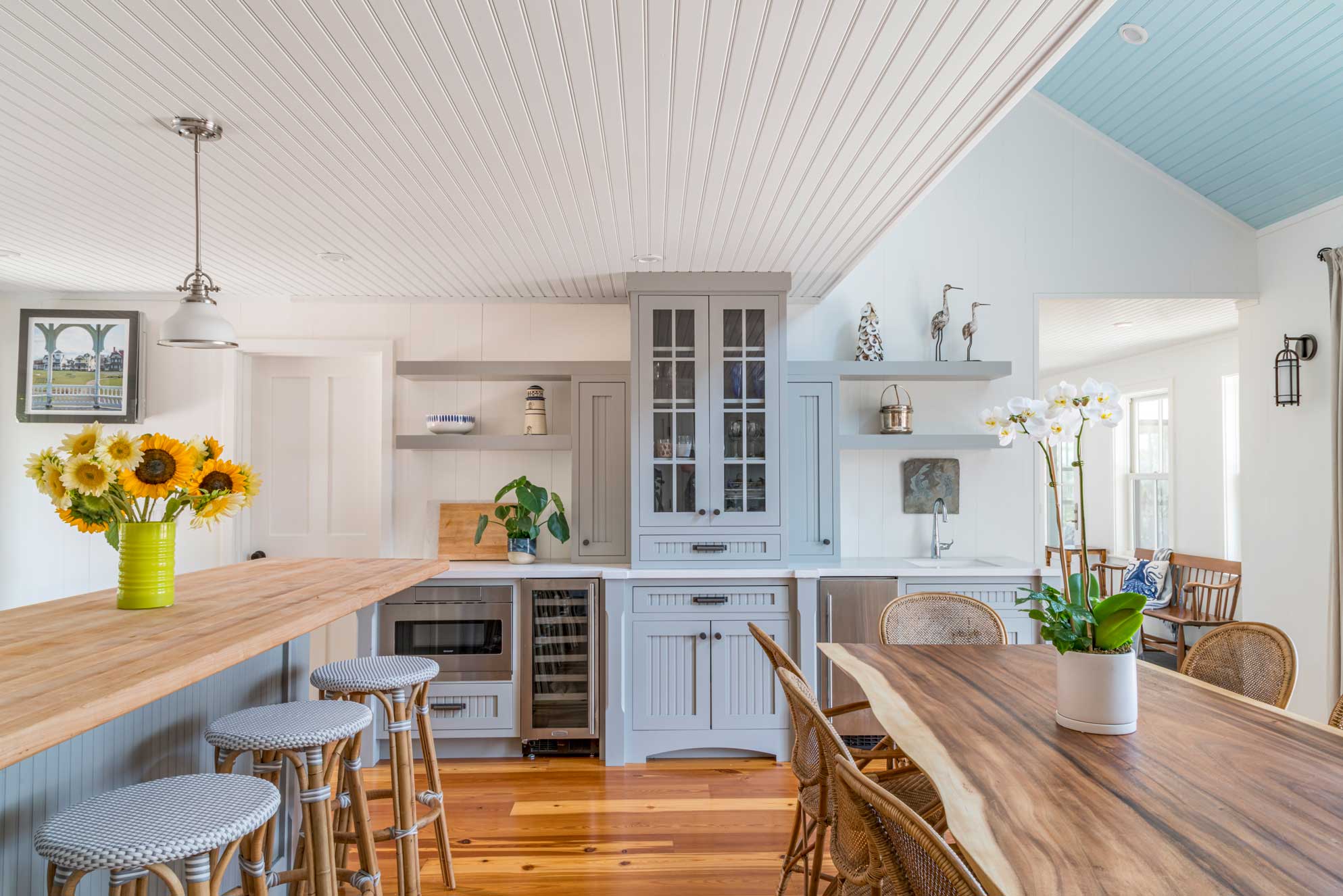 remodeled kitchen with blue cabinets and butcher block counter