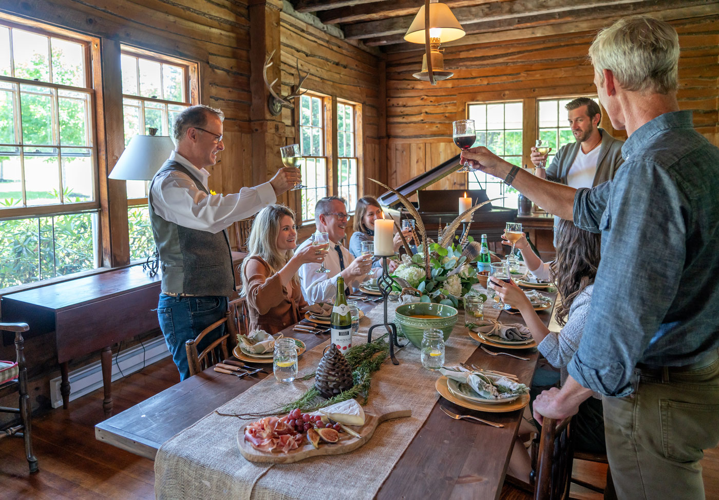 The staff at Carter & Company celebrating at interior designer Michael Carter's New Hampshire retreat