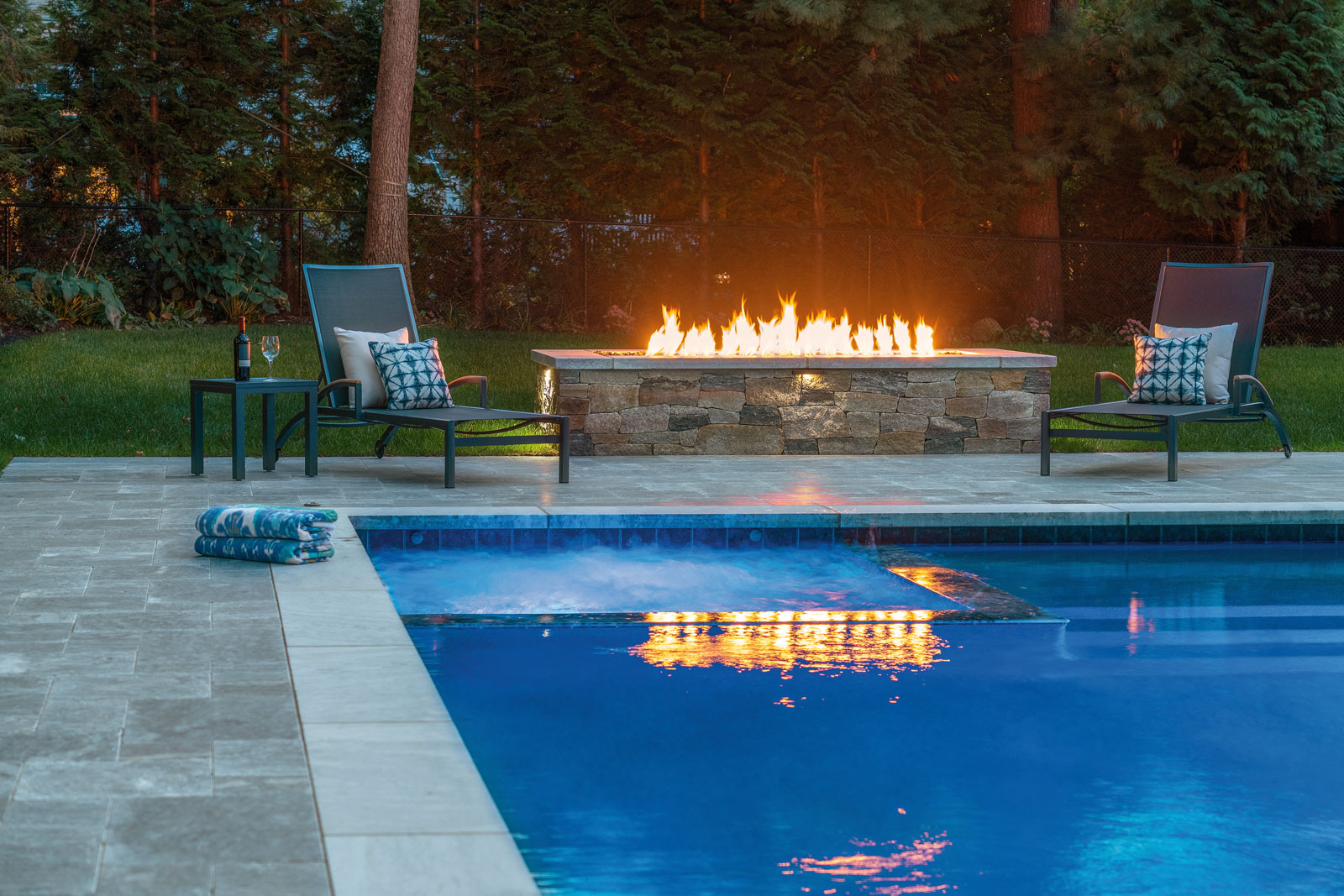 Marble Terrace and Fire Feature by Boston landscape professional Onyx Corporation