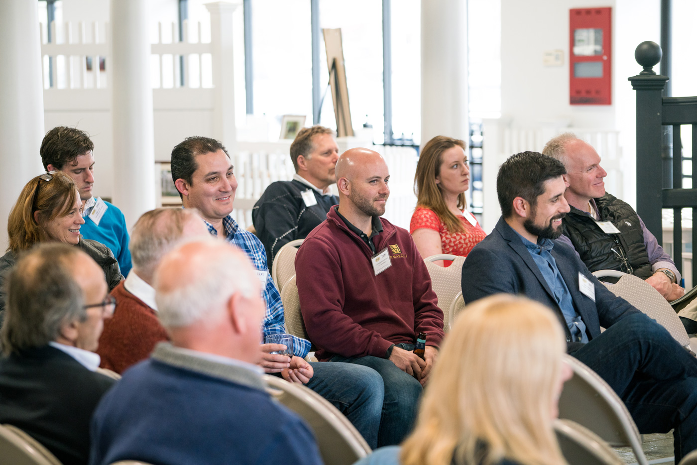 Audience listening to panelists at Perfection Fence event