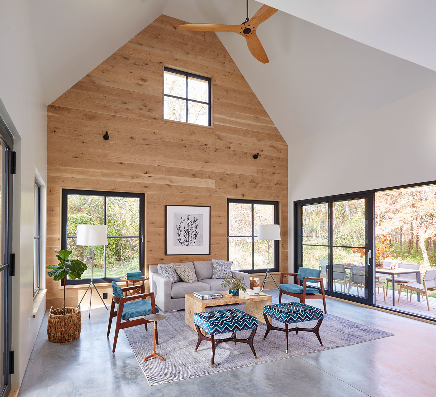 Double-height vaulted ceiling living room by Paul Weber Architecture