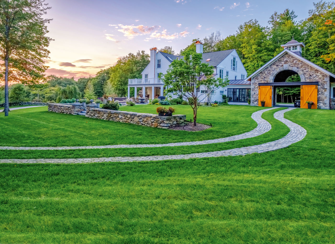 High-end landscape design and driveway by Pellettieri Associates, Inc.