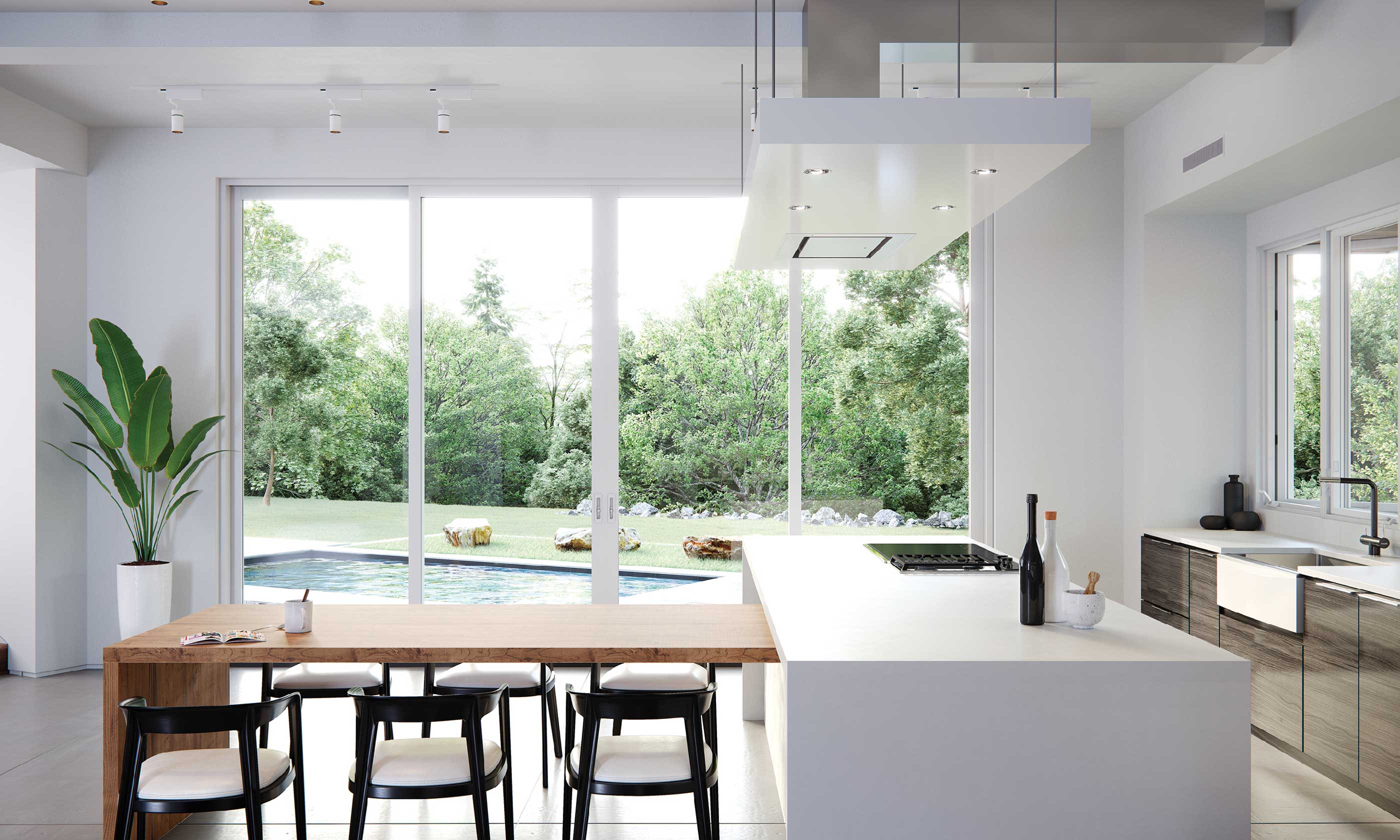 Kitchen with floor to ceiling windows overlooking a pool