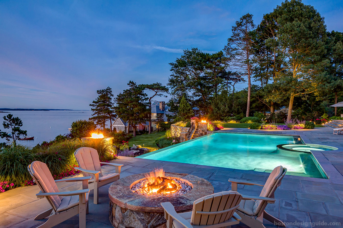 Dusk scene of coastal outdoor living by R.P. Marzilli & Company