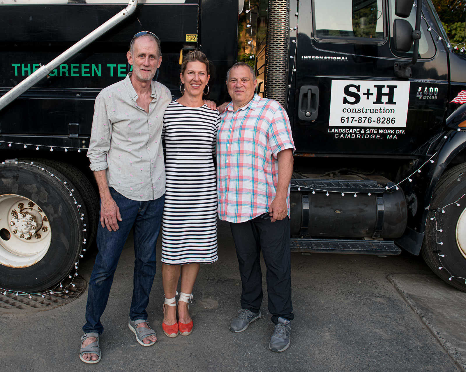 Founders Alex Slive and Doug Hanna of S+H Construction flank President and Owner Sarah Lawson