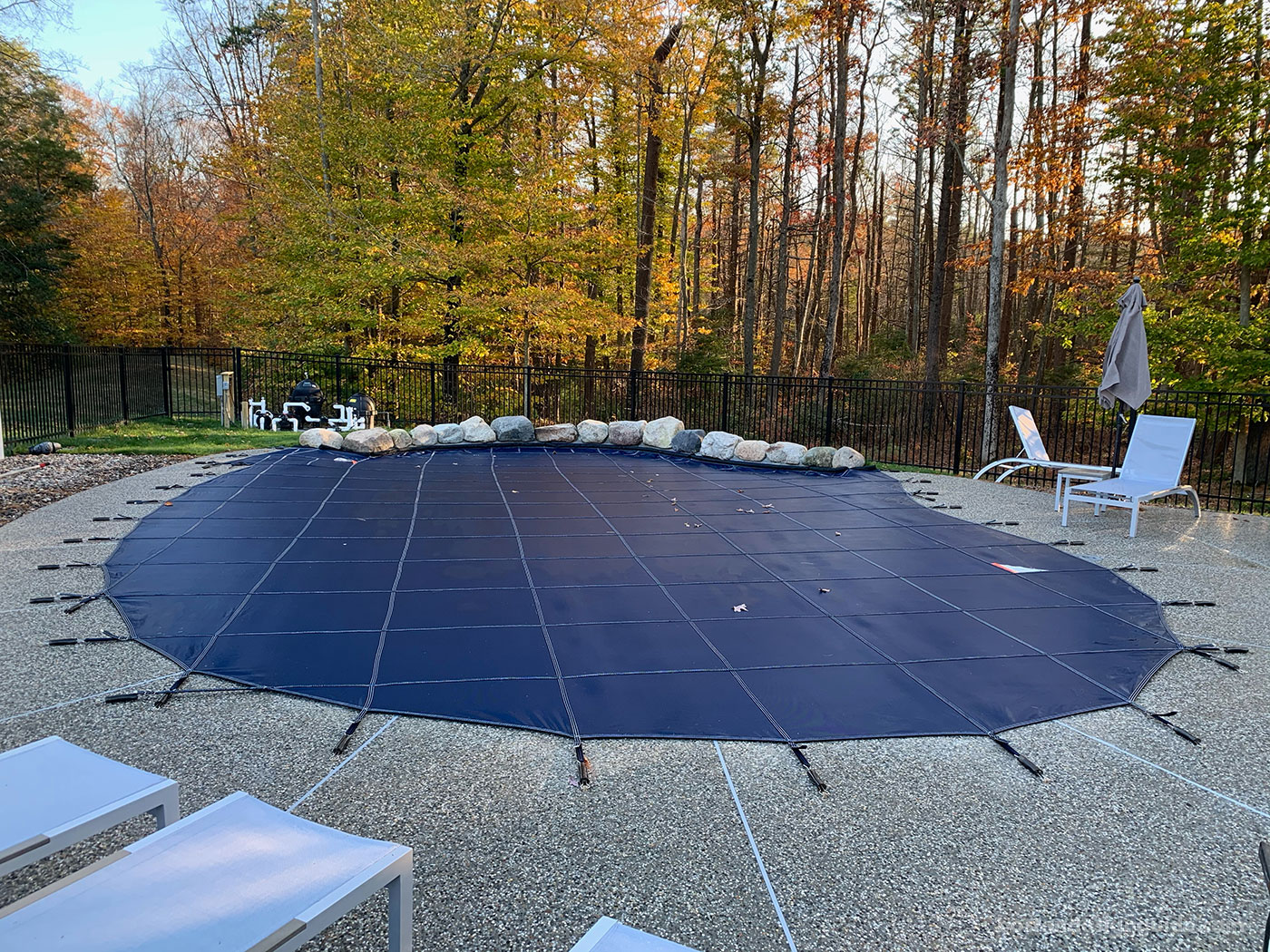 Custom gunite pool by top New England pool company SSG Pools & Spas with pool cover