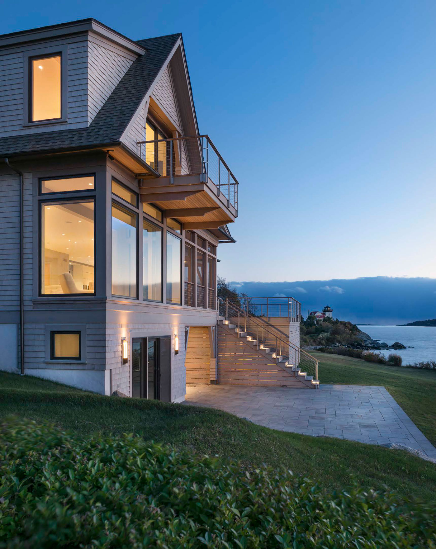 back view of beautiful home along the water