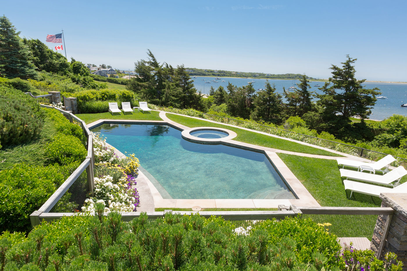 Seaside pool terrace by high-end landscape professionals The Schumacher Companies