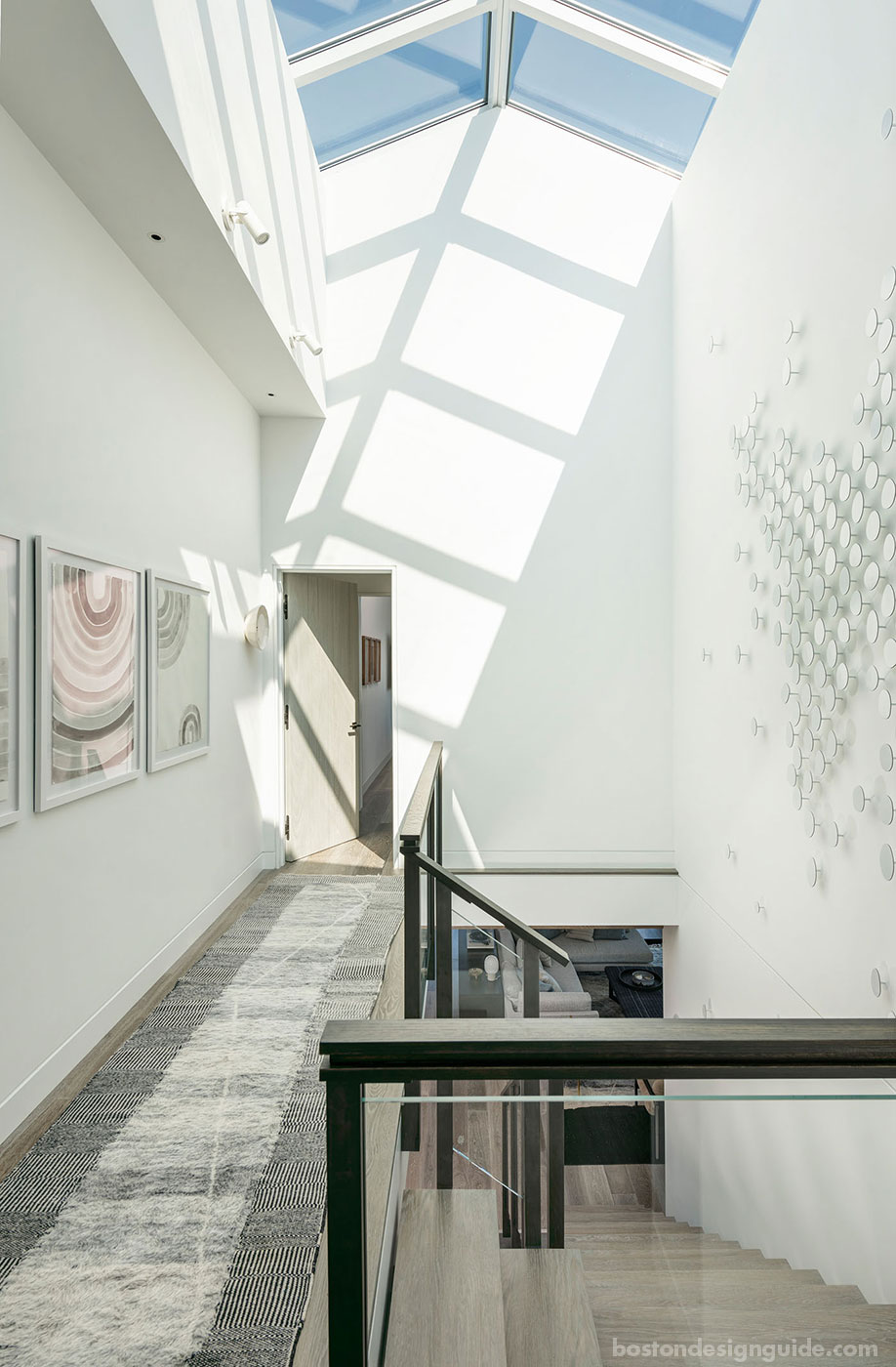 Light-filled stair hall with skylight constructed by S.J. Overstreet Construction Co., Inc.