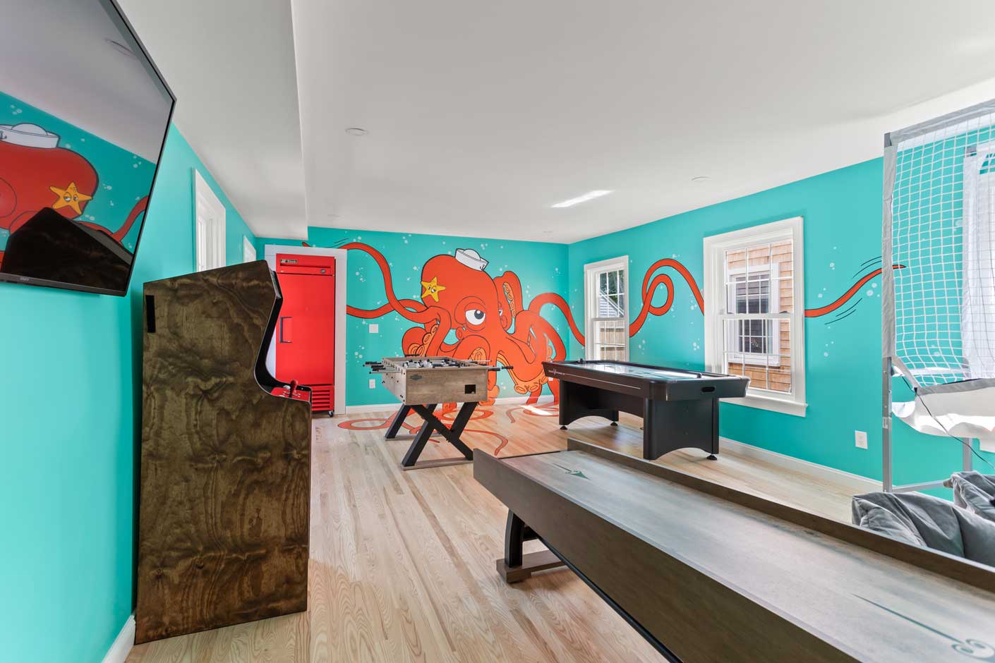 game room with octopus painted on the wall