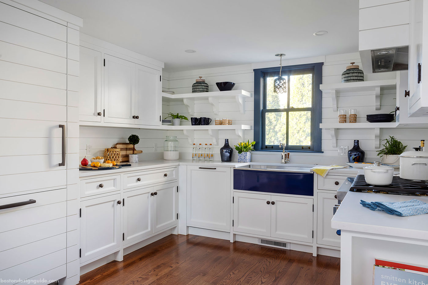 Custom coastal kitchen by custom home builder WKP Construction with nickel gap paneing