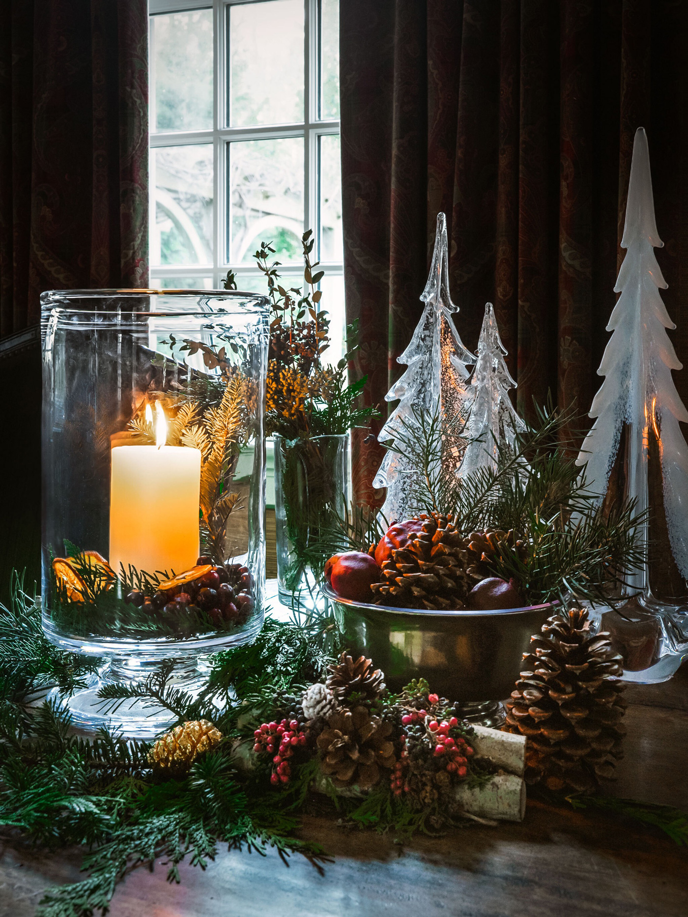 Table set up with votives, candles and greenery