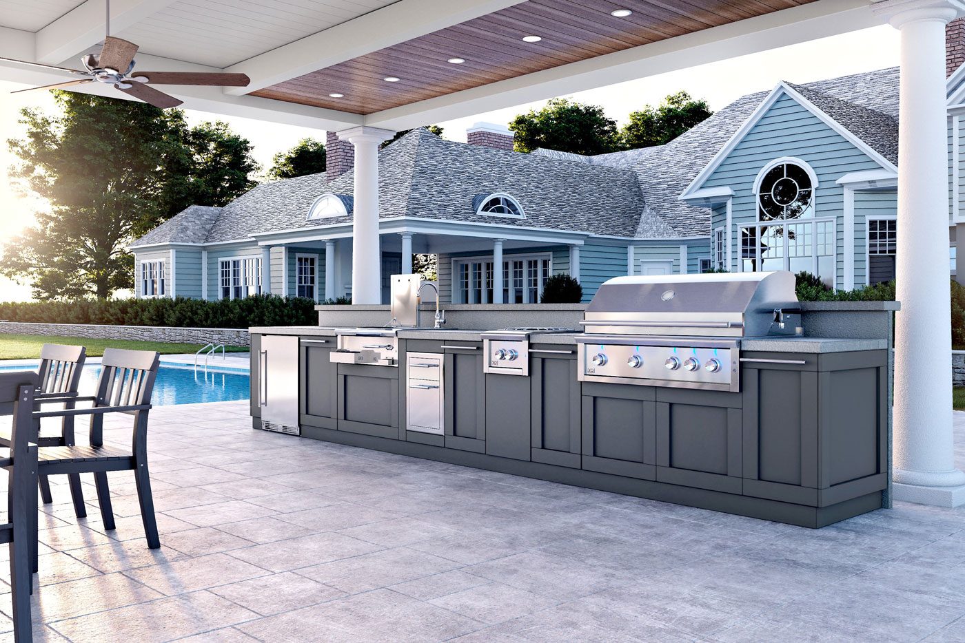 Outdoor kitchen in backyard next to pool