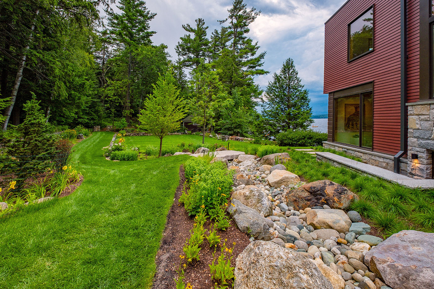 High-end landscape with water view by landscape design/build firm Pellettieri Associates, Inc.